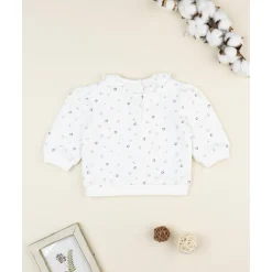 Camiseta blanca de niña con corazones y volantes