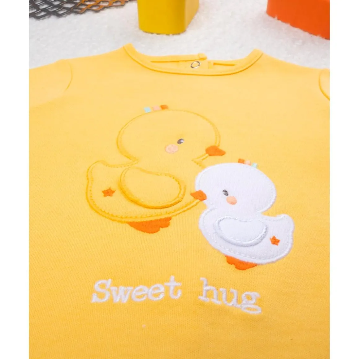 Mameluco unisex amarillo baby smile