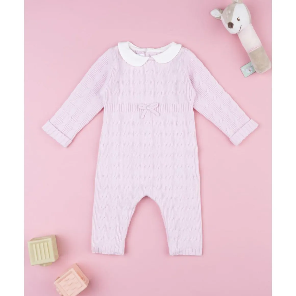 Pelele tricot rosa de niña con lazo