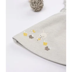 Peto con falda niña beige con bordados