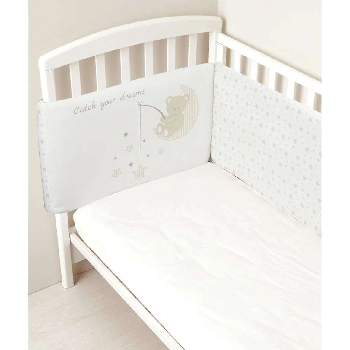 Protector de cuna con lazos